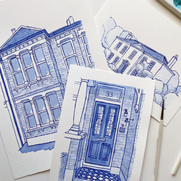 Kerri Awosile Blue Delft Style watercolour house and door illustrations, laying flat with a paintbrush and paint palette next to them